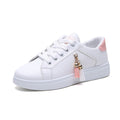 White and pink low-top sneakers featuring decorative tassels on the side, designed for comfort and style as Summer Breathable Running Korean Casual Sports Shoes.