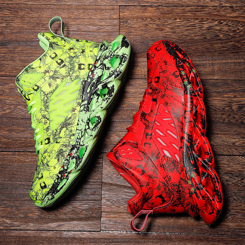 Pair of Trendy Camouflage Sports And Leisure Blade Old Shoes in bright neon green and vibrant red with black abstract patterns, displayed on a wooden floor background