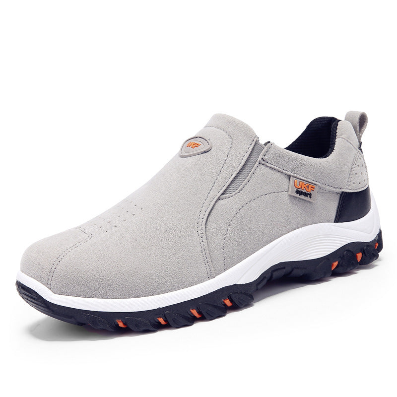Gray slip-on Mountain shoes outdoor men's shoes lazy shoes with black and white sole and orange accents designed for casual outdoor activities.