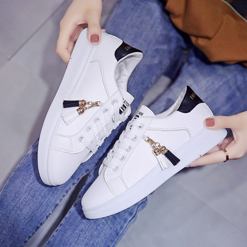 Summer Breathable Running Korean Casual Sports Shoes in white with black accents, featuring tassel charms, designed for stylish and comfortable everyday wear.