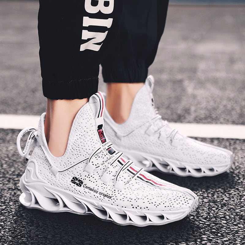Close-up of white Sports shoes running shoes with intricate sole design and breathable upper material worn with black pants on asphalt surface.