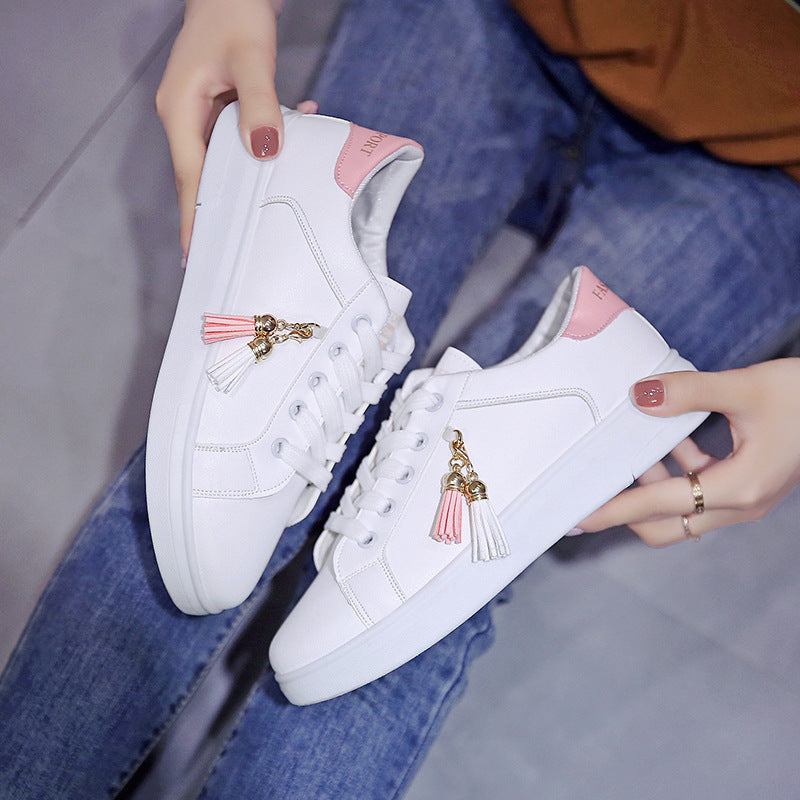 Summer Breathable Running Korean Casual Sports Shoes in white with pink accents and decorative tassels, designed for comfortable and stylish casual wear.