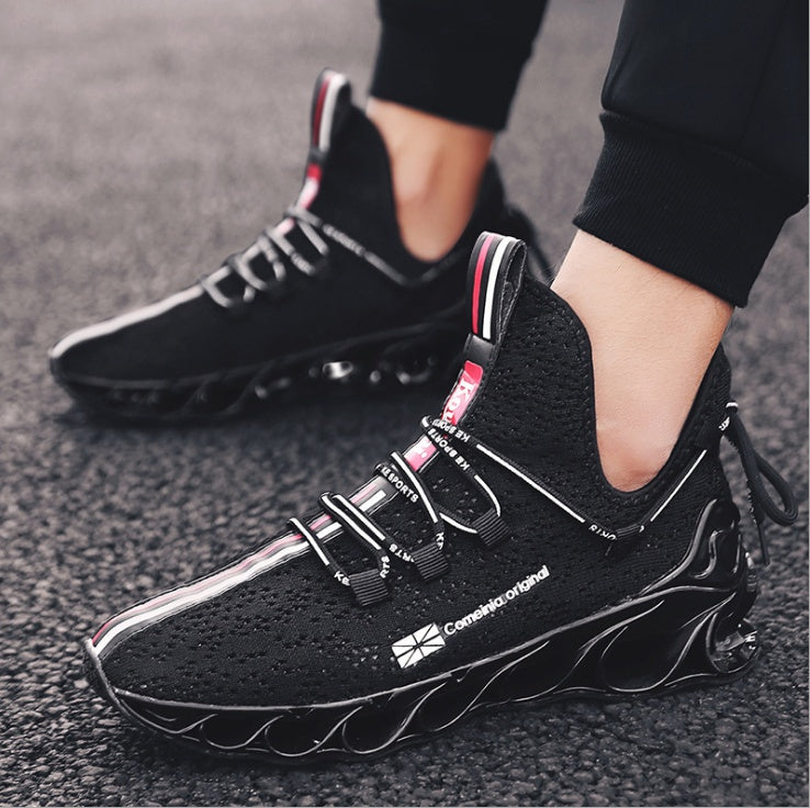 Black breathable sports shoes running shoes with unique wavy sole design and subtle red and white accents, worn with black athletic pants for a sleek sporty look.