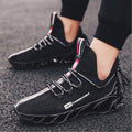 Black breathable sports shoes running shoes with unique wavy sole design and subtle red and white accents, worn with black athletic pants for a sleek sporty look.